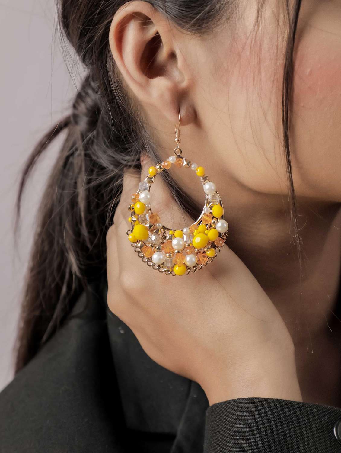 elegant circular dangle earrings with gold tone finish