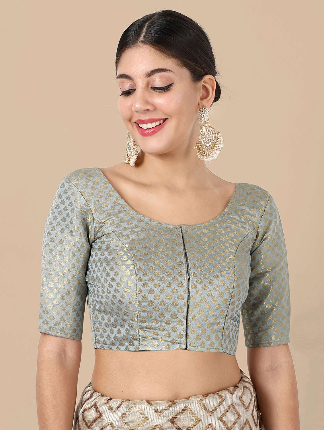 women self design round neck stitched blouse