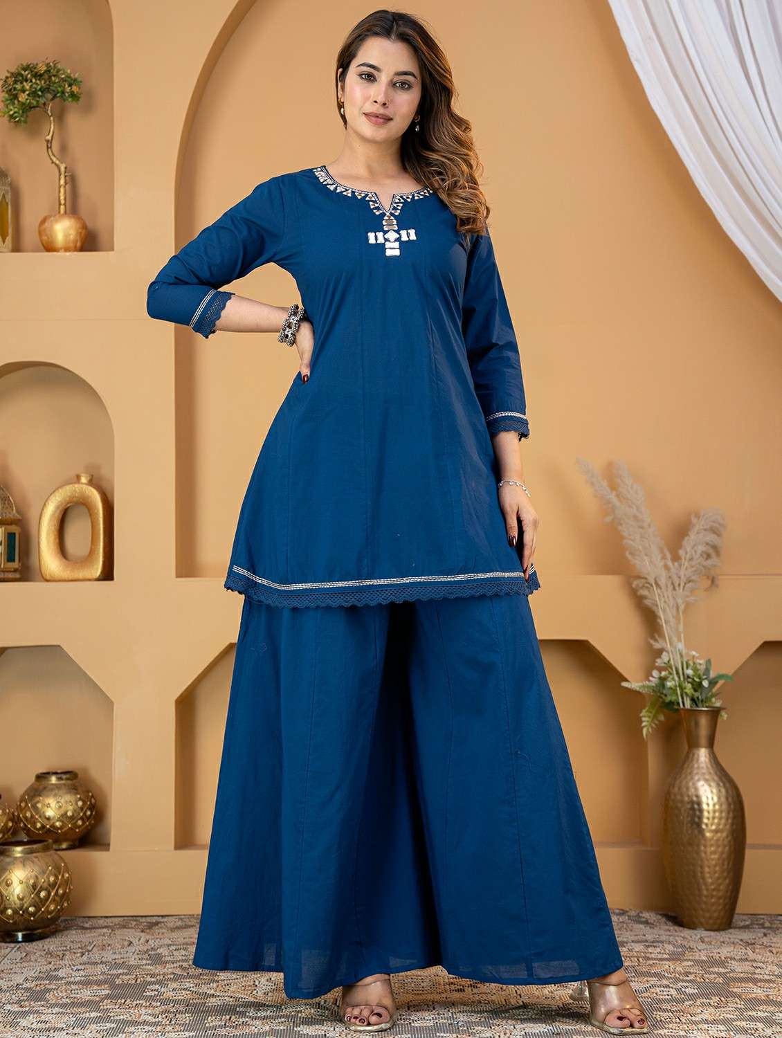 women embroidered notch neck kurta and palazzo set