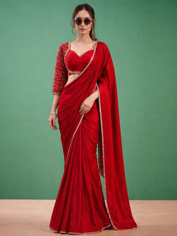women solid with embellished bordered saree with blouse