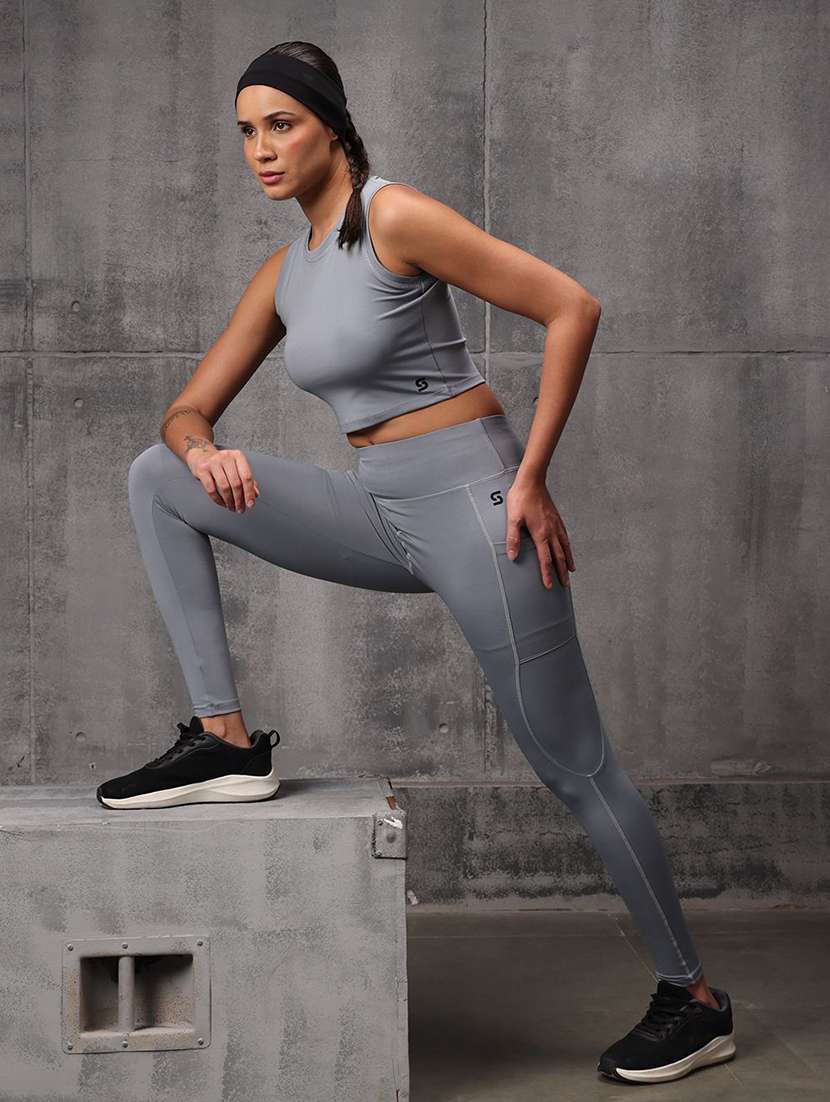 women solid sleeveless top and leggings active wear set