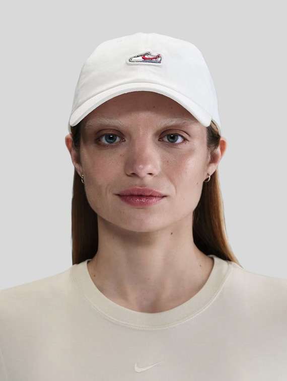 white cotton base ball cap with shoe patch