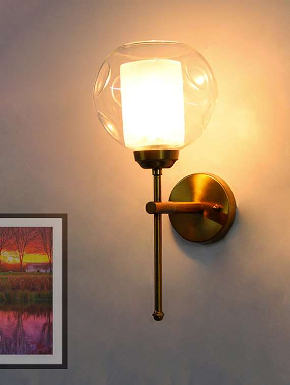 contemporary brass wall light clear glass