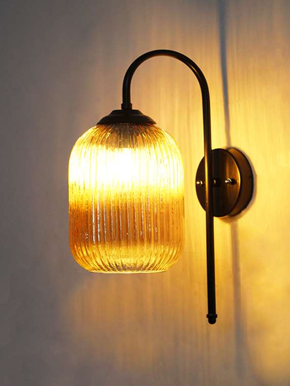 modern amber ribbed black wall sconce