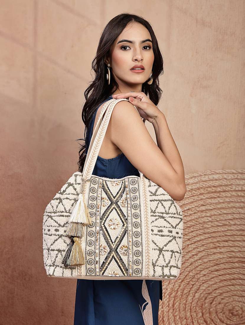 geometric pattern cotton canvas hobo bag with embellishment and button closure - 22541935 -  Standard Image - 5