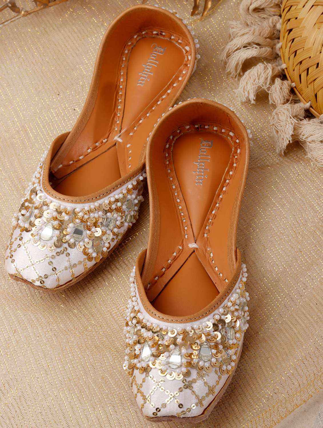 women embroidered slip on jutis