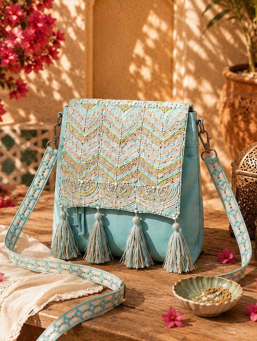 women embellished sling bag