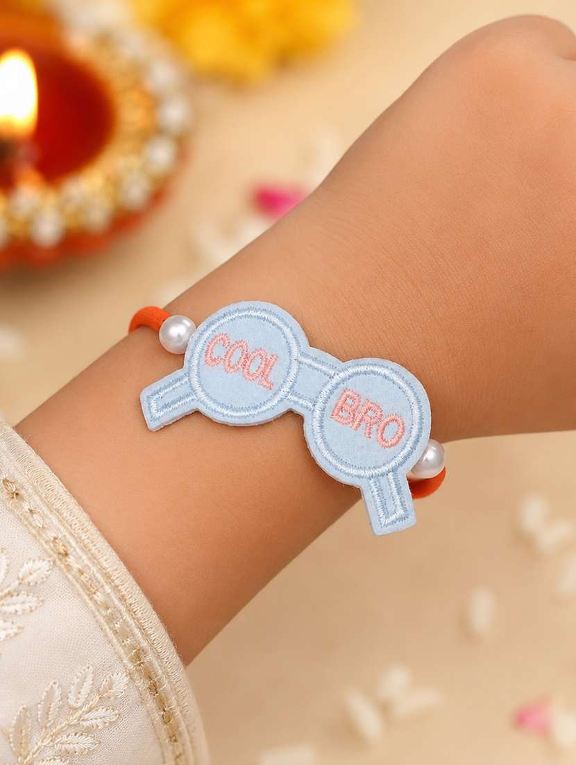 handcrafted thread rakhi with pearls