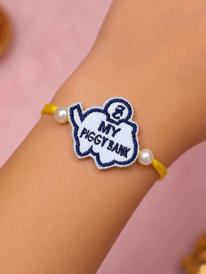 handcrafted thread rakhi with pearls