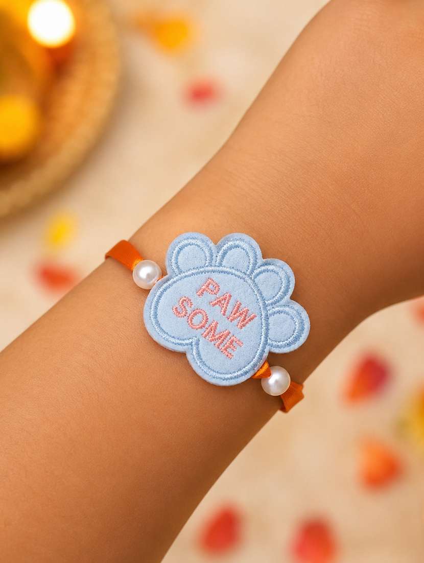 handcrafted thread rakhi with pearls