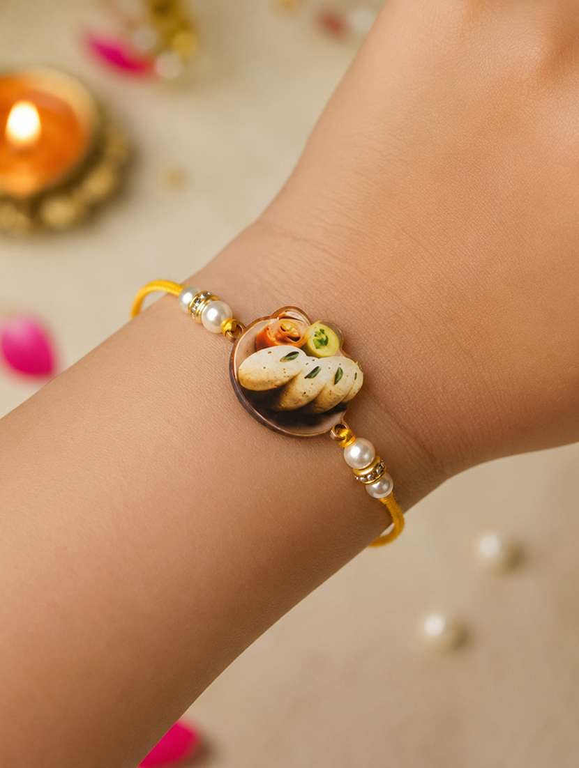 the magic wand trendy quirky idli wooden rakhi with pearls embelishement