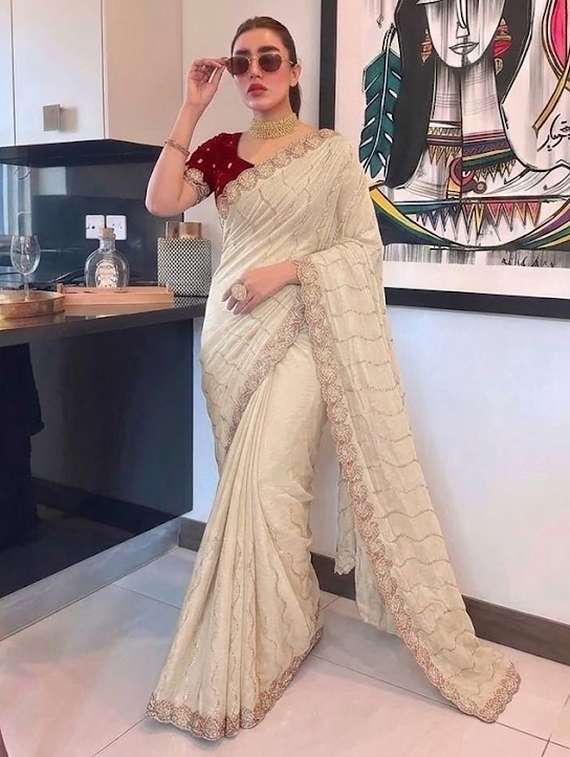 women solid with work embroidered saree with blouse