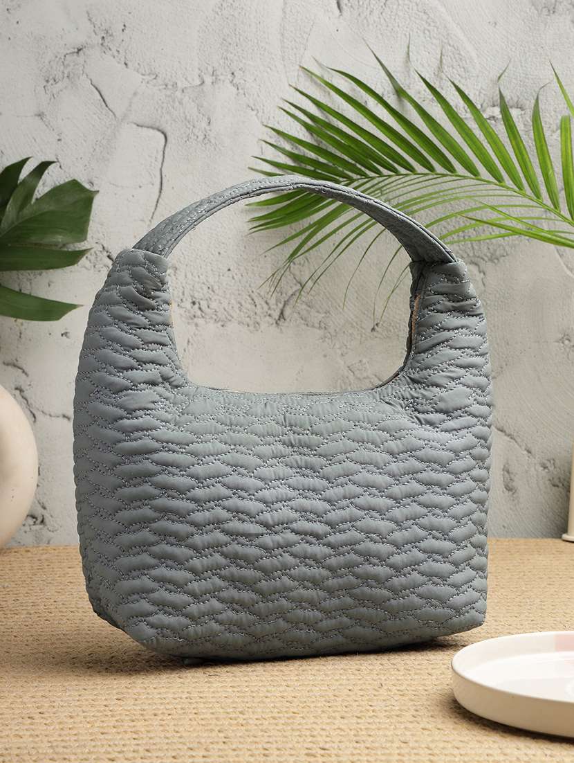 blue polyester quilted handbag with zip closure