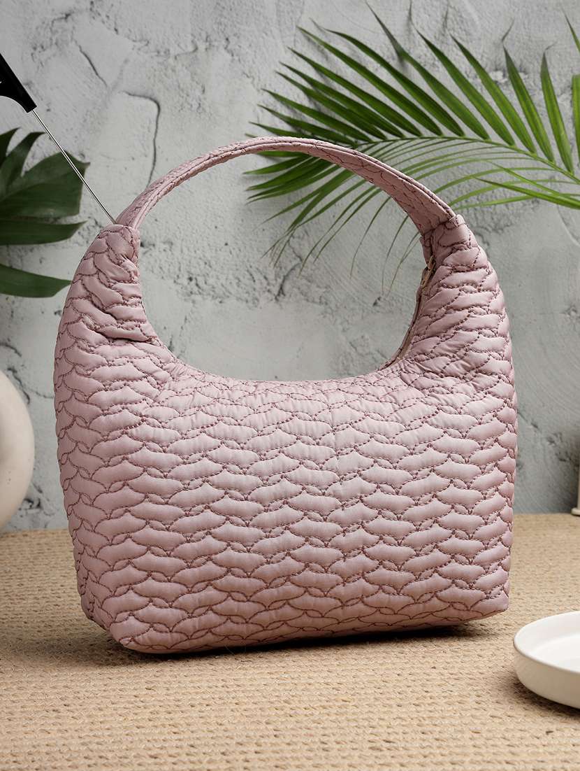 women textured shoulder handbag