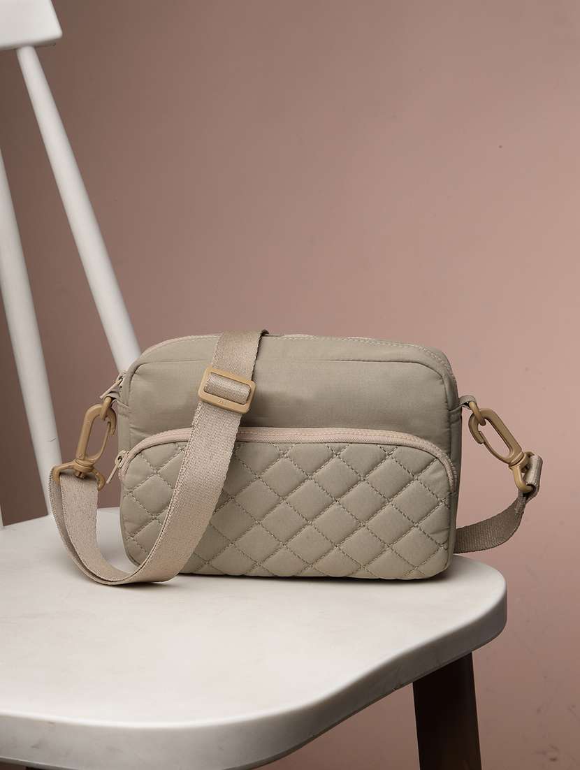 women textured sling bag with adjustable strap