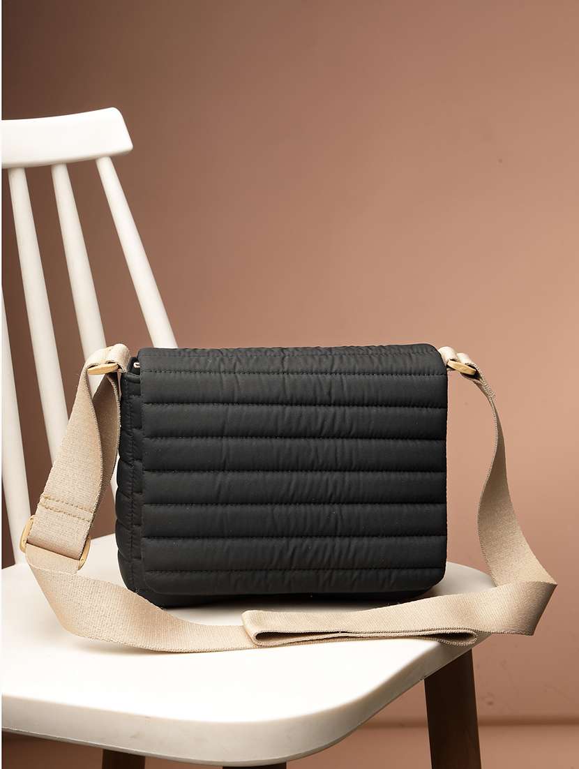 women textured sling bag with adjustable strap