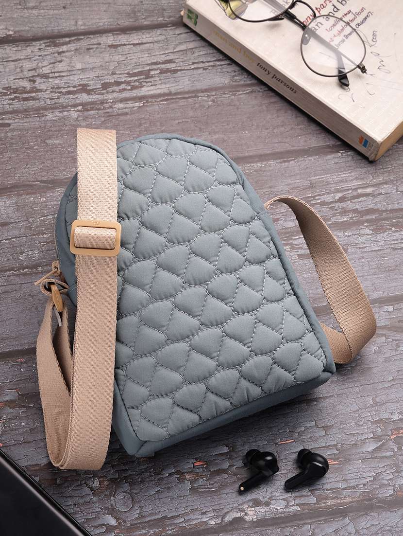 women textured sling bag with adjustable strap