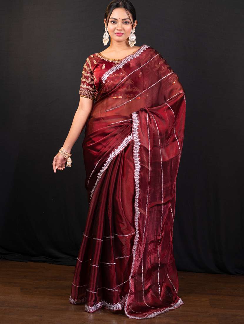 women solid with work embellished saree with blouse