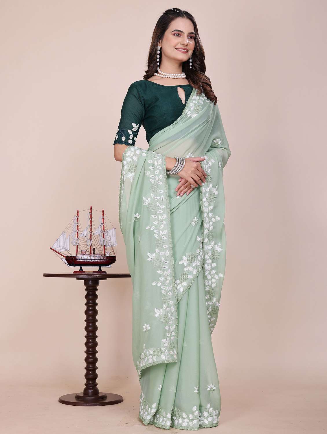 women solid with work embroidered saree with blouse