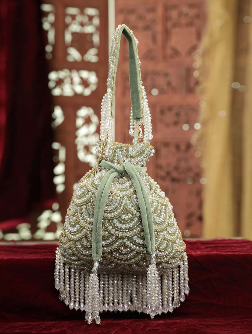 green velvet embellished potli bag with drawstring closure
