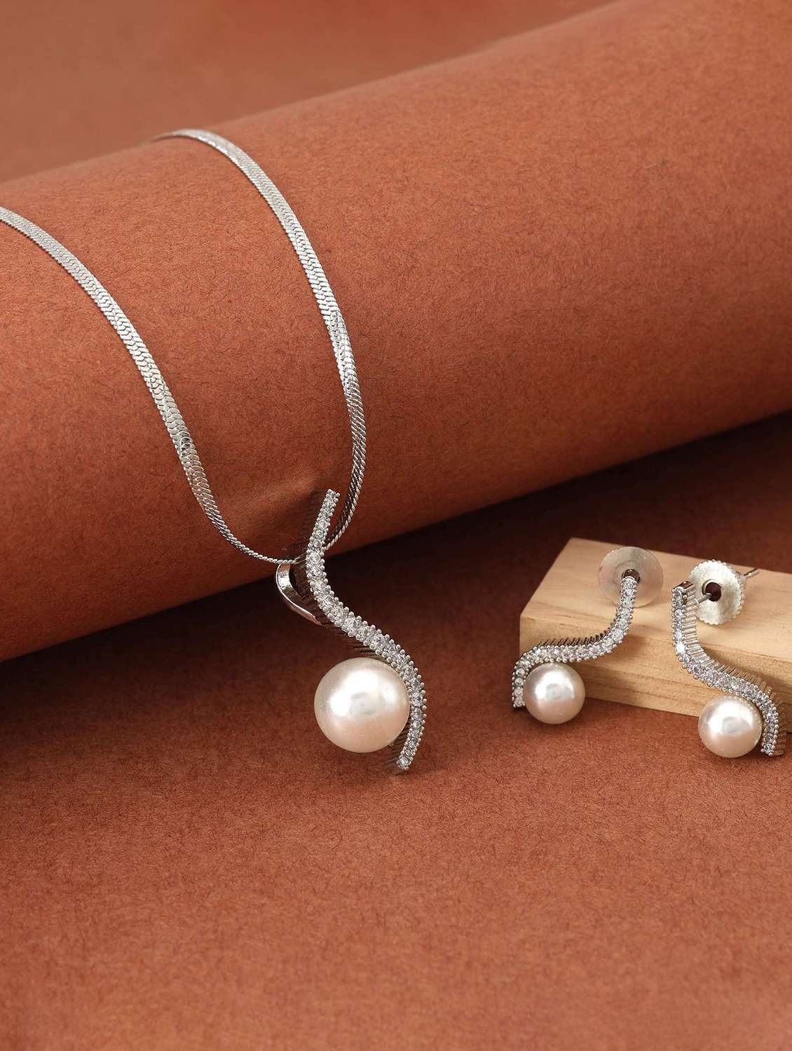 women silver plated necklace and earrings set with pearls