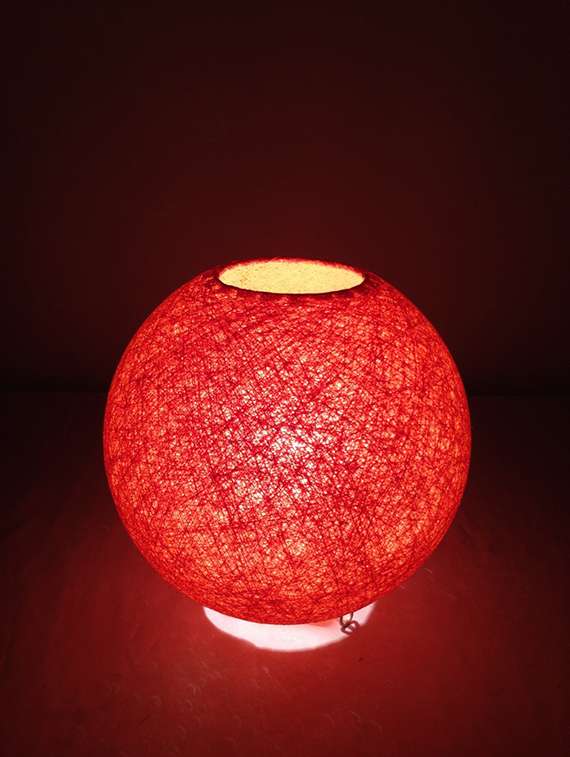 ball- shaped table lamp shade made up of yarn